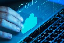 Hand hovering over a laptop keyboard with a cloud icon, illustrating cloud storage technology relevant to digital marketing and enterprise solutions.